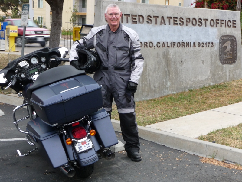 Boyd in front of the San Ysidro Post Office sign