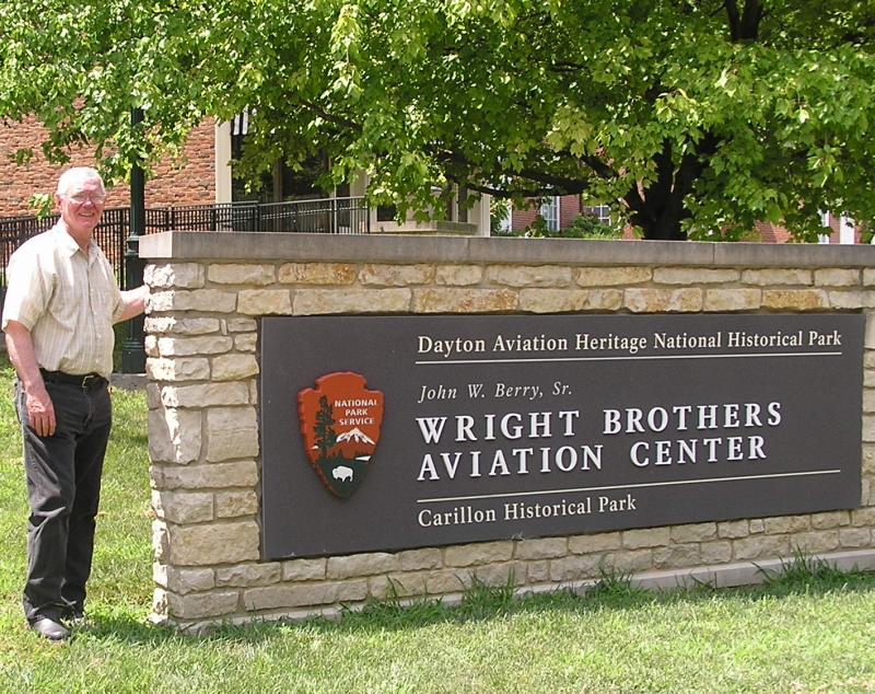 Boyd in front of the Aviation Center sign