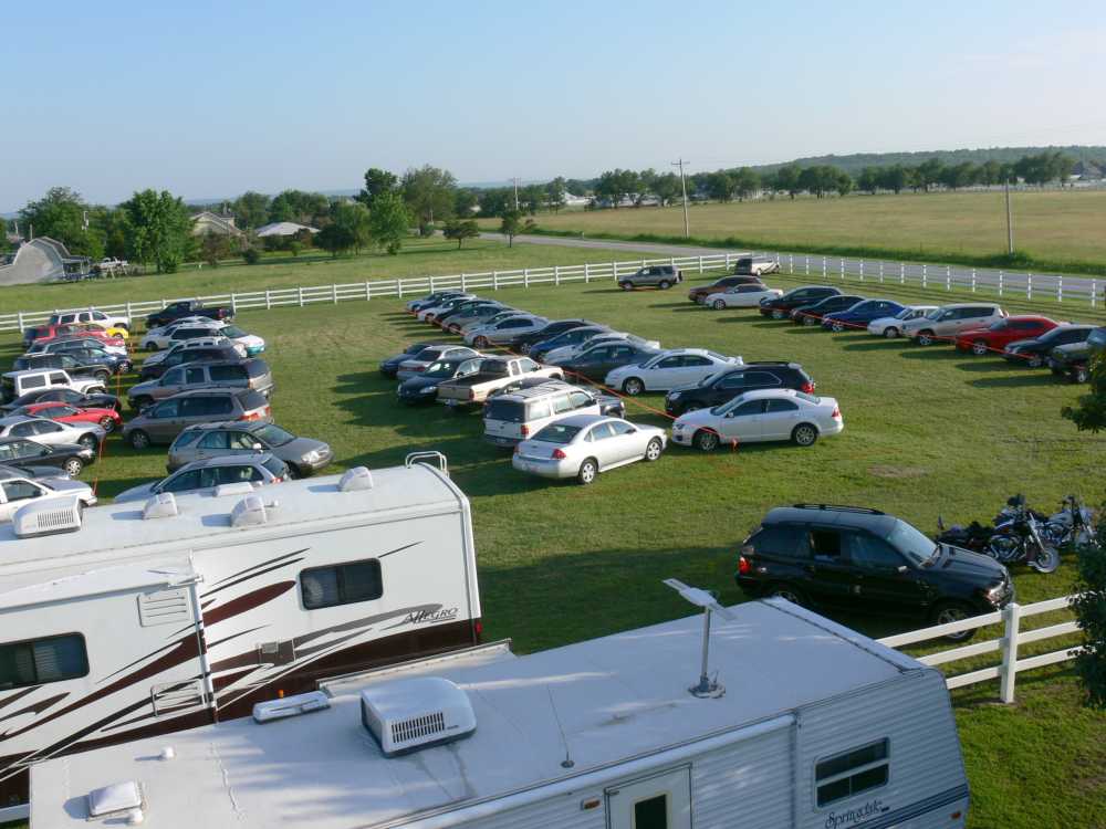 Picture of cars parked in horse pasture